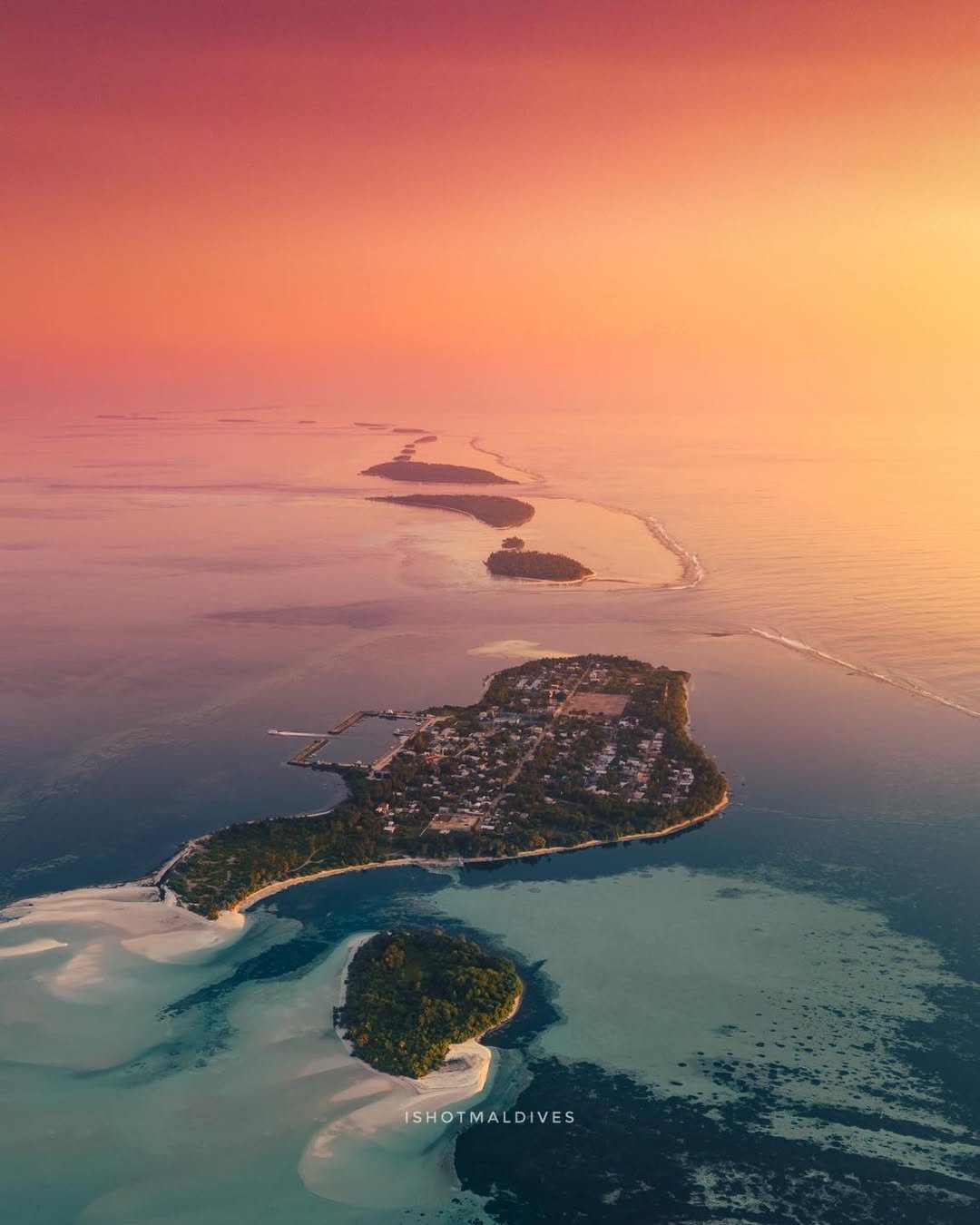 Aerial view of the island chain near Gemanafushi at sunset. Photo credit: ishotmaldives