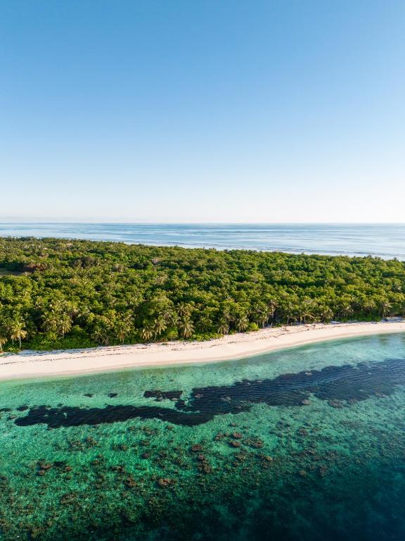Aerial view of Kondey's coastline and reef at sunrise