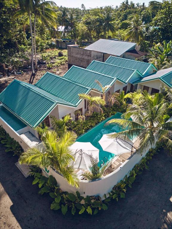 Aerial view of the boutique villa stay on Kondey, with pool and palm trees
